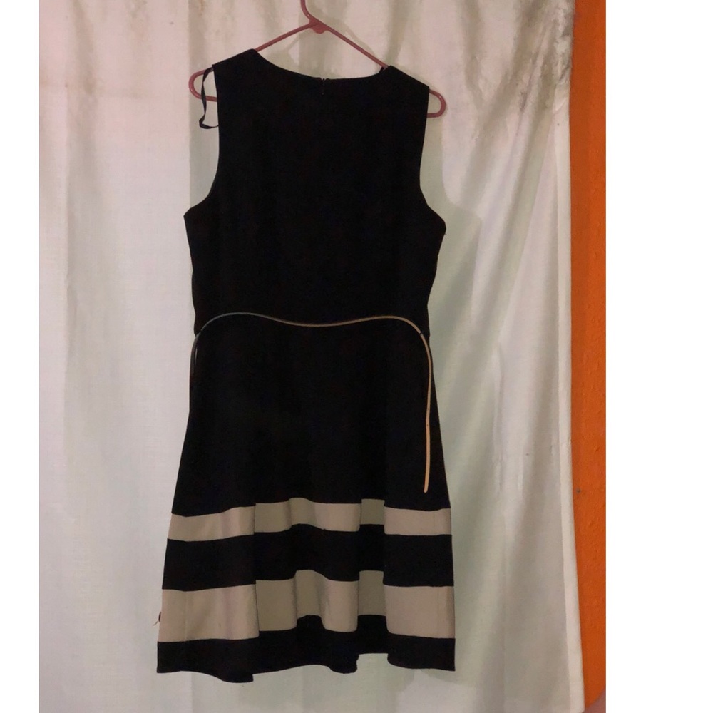 Black dress with tan stripes and black belt
